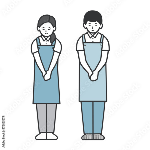 おじぎする従業員男女