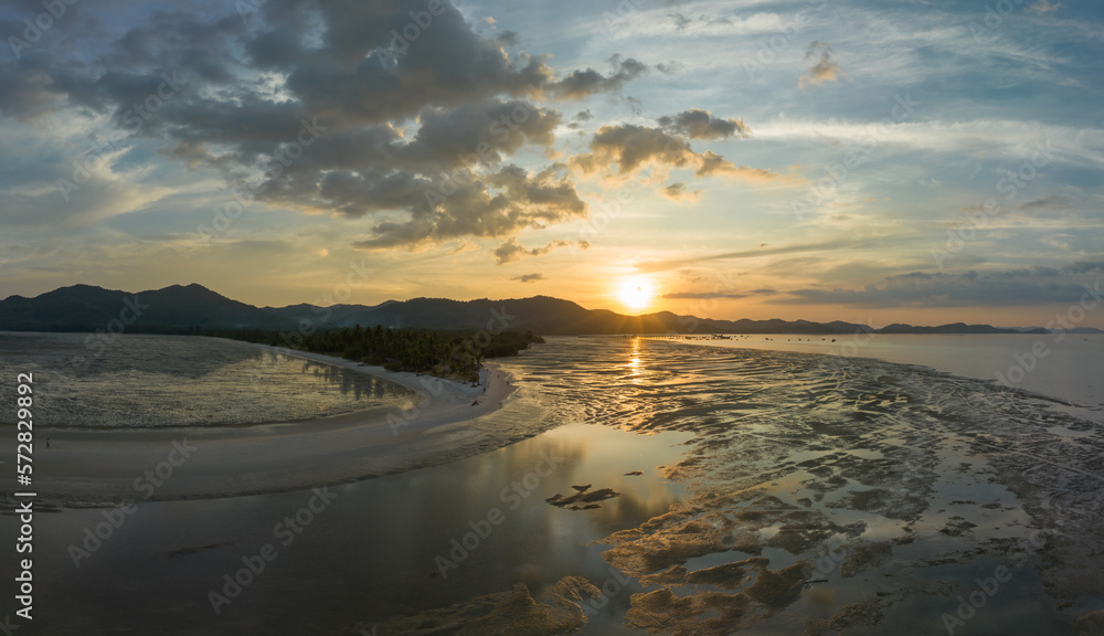 Fototapeta premium Aerial view sunset shot made with drone on the island of Koh Yao Yai, Phuket. .4K Shooting With Drone. Beach in tropical paradise, Koh Yao Yai island in Phang-nga, Thailand. .Landscape with tropical.