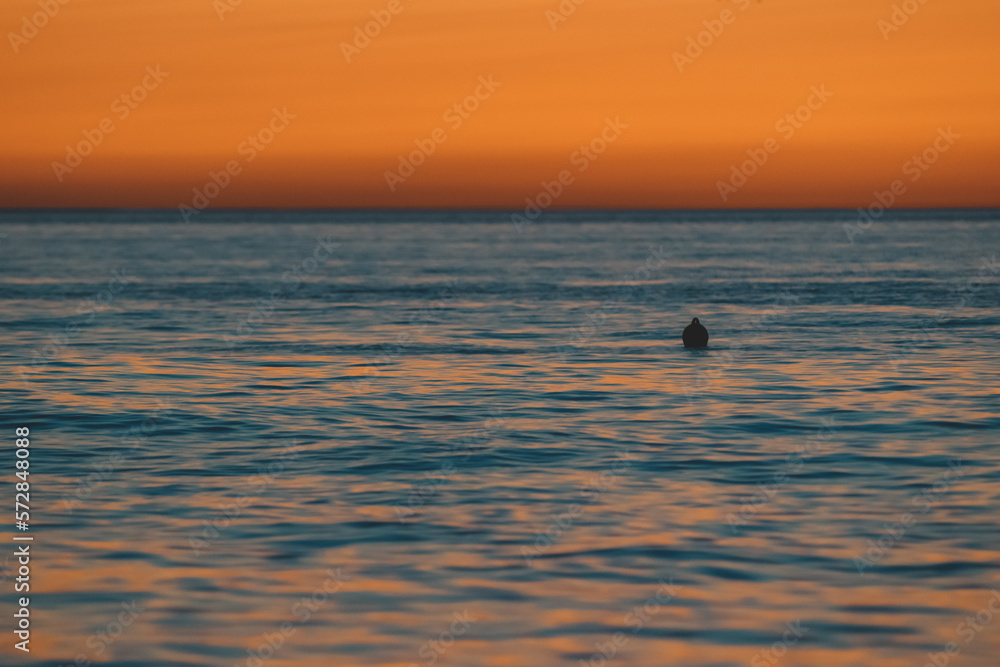 Sunset on the sea background, Yacht and tourists on the sea