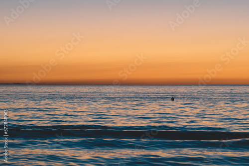 Sunset on the sea background, Yacht and tourists on the sea © natia
