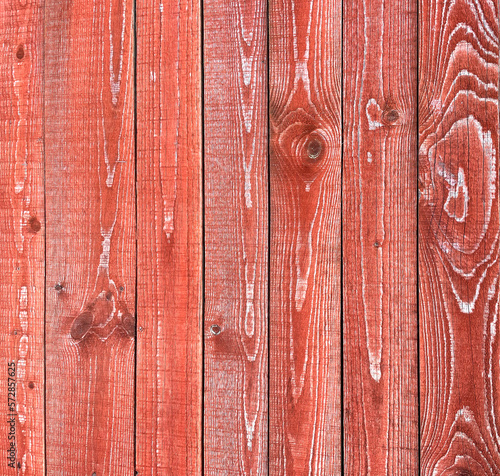 Wooden old red fence made of vertical boards
