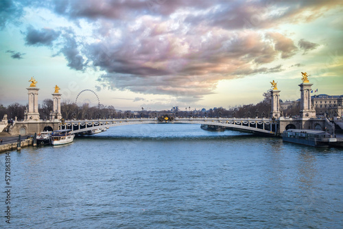 Photography Paris, the Alexandre III bridge on the Seine, with houseboats on the river,