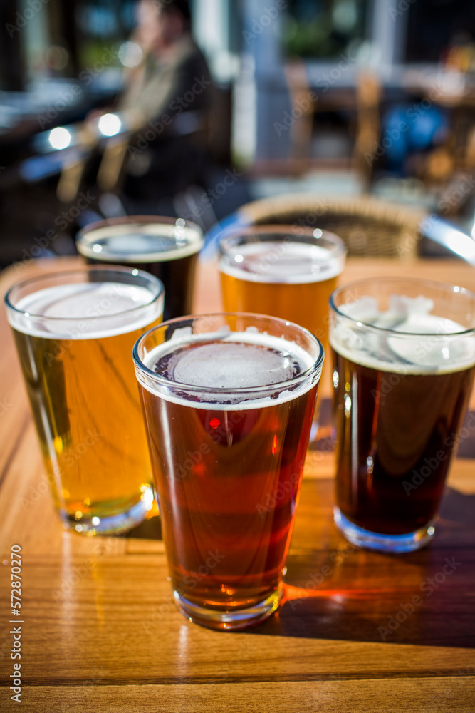 A variety of beers at Half Moon Bay Brewing Company in Half Moon Bay, California on a sunny day. A variety of beers at Half Moon Bay Brewing Company in Half Moon Bay, California on a sunny day.