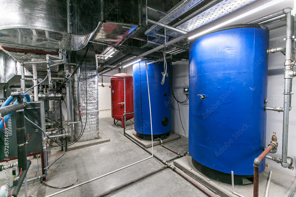 Huge industrial boiler services and air handling unit in the ventilation plant room with
