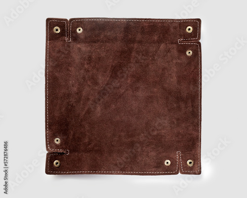 Unfolded brown suede leather tray for keeping keys