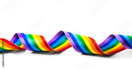 Colorful LGBTQ rainbow ribbon close up, isolated on white background. LGBT colourful design. Gay pride design. Curly, waving ribbon or banner with flag of LGBTQ pride art photo