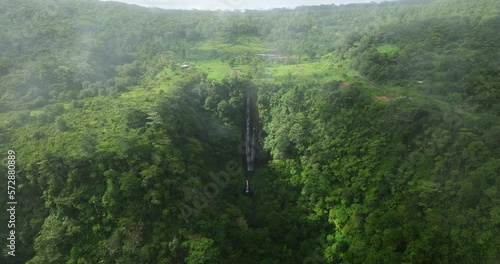Flying Through Clouds Over Rainforest Mountains With Papapapaitai Falls On Upolu Island, Samoa. Aerial Drone Shot photo