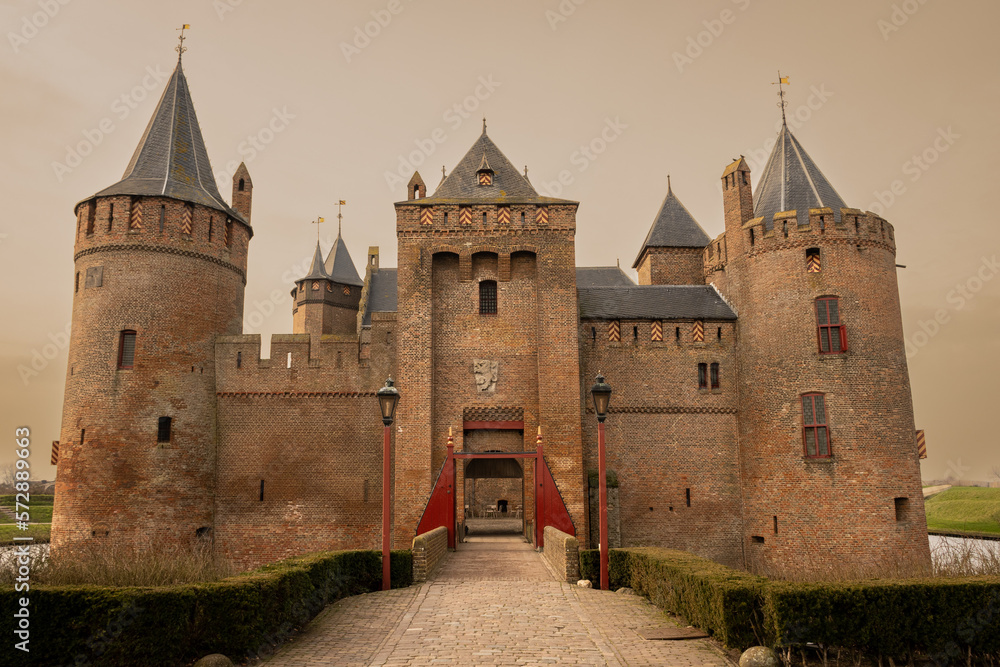 Muiderslot castle in Muiden Netherlands 14th century historic building architecture for defence. Fort is now museum and place of interest for tourists to visit and learn Dutch history in Holland