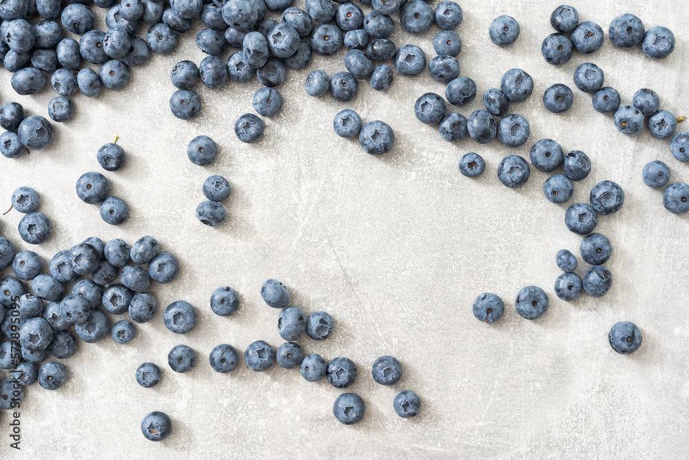 Fresh blueberries on gray background. Blueberries background. Healthy berry, organic food, antioxidant, vitamin, blue food. Fresh blueberries on gray background. Blueberries background. Healthy berry, organic food, antioxidant, vitamin, blue food.