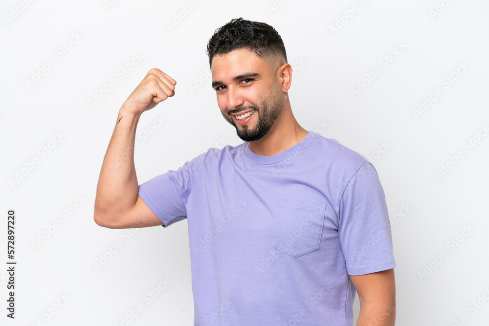 Young Arab handsome man isolated on white background doing strong gesture Young Arab handsome man isolated on white background doing strong gesture