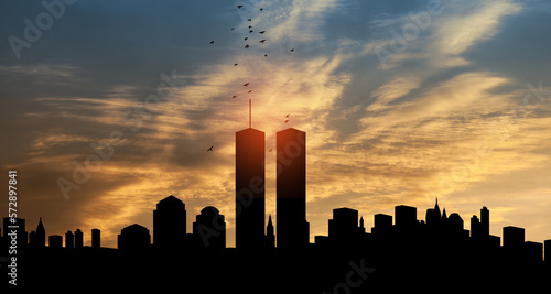 New York skyline silhouette with Twin Towers and birds flying up like souls at sunset. 09.11.2001 American Patriot Day banner. photo