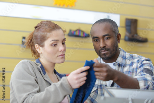 couple looking at working clothe at hardware store