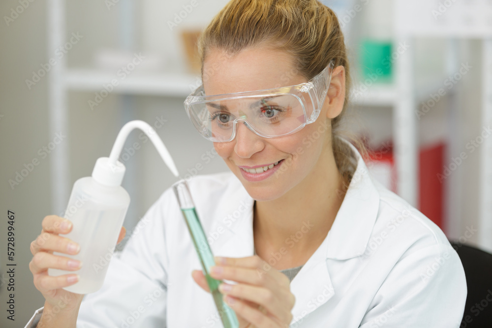 female biologist chemist doing laboratory experiments female biologist chemist doing laboratory experiments