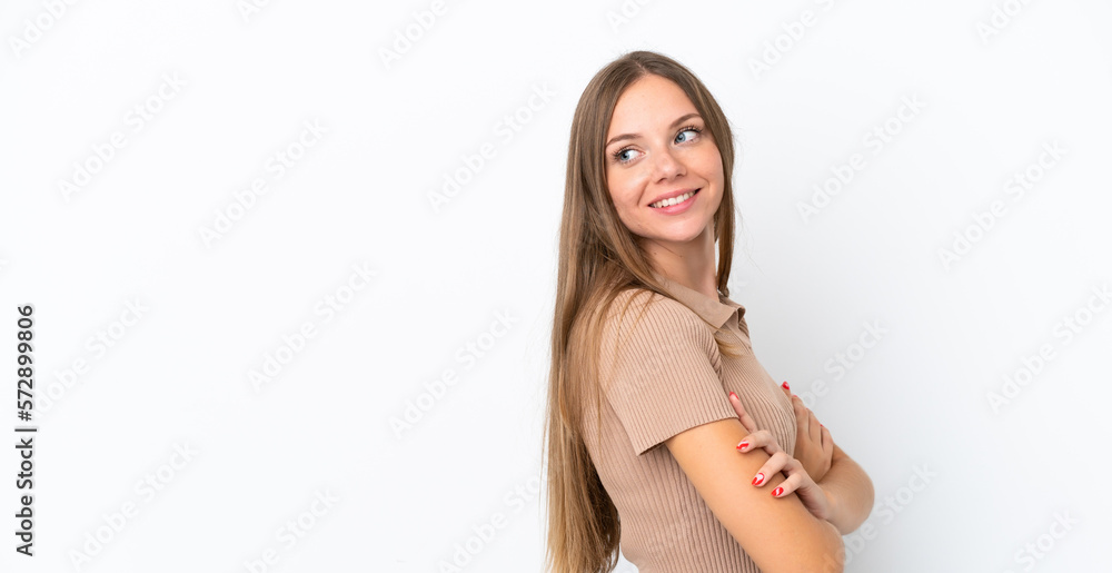 Young Lithuanian woman isolated on white background with arms crossed and happy Young Lithuanian woman isolated on white background with arms crossed and happy