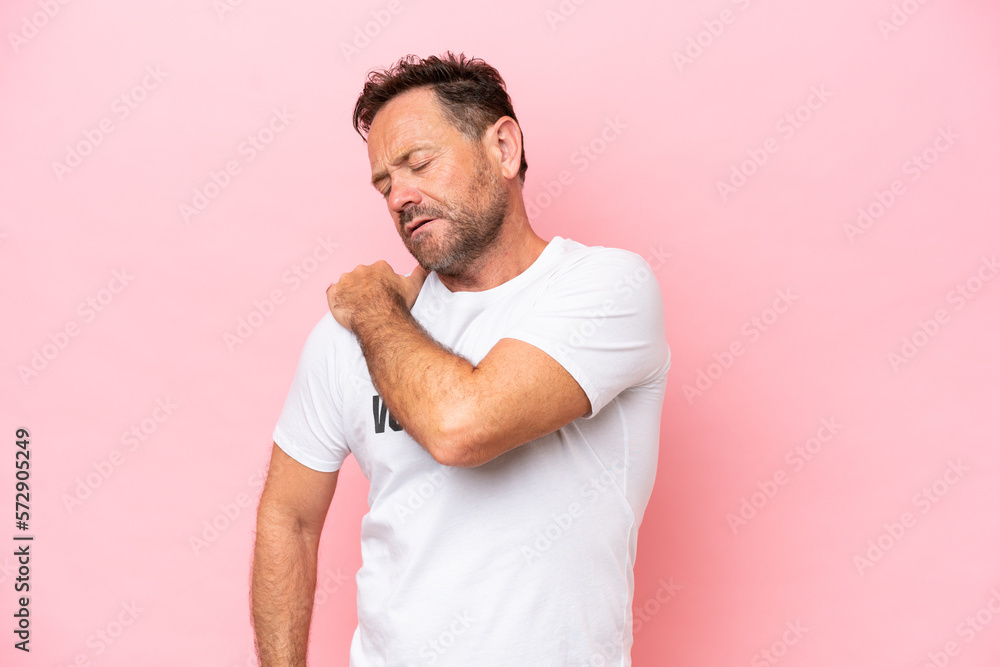 Middle age volunteer man isolated on pink background isolated on pink background suffering from pain in shoulder for having made an effort Middle age volunteer man isolated on pink background isolated on pink background suffering from pain in shoulder for having made an effort
