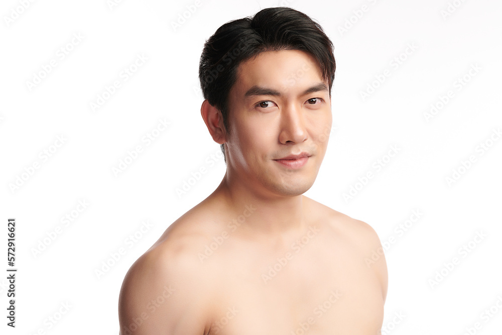 Portrait of shirtless young handsome Asian man for skincare and beauty concepts against on white background,
