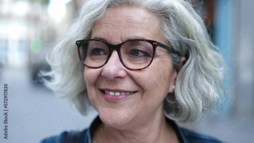 Middle age woman with grey hair smiling confident at street Middle age woman with grey hair smiling confident at street