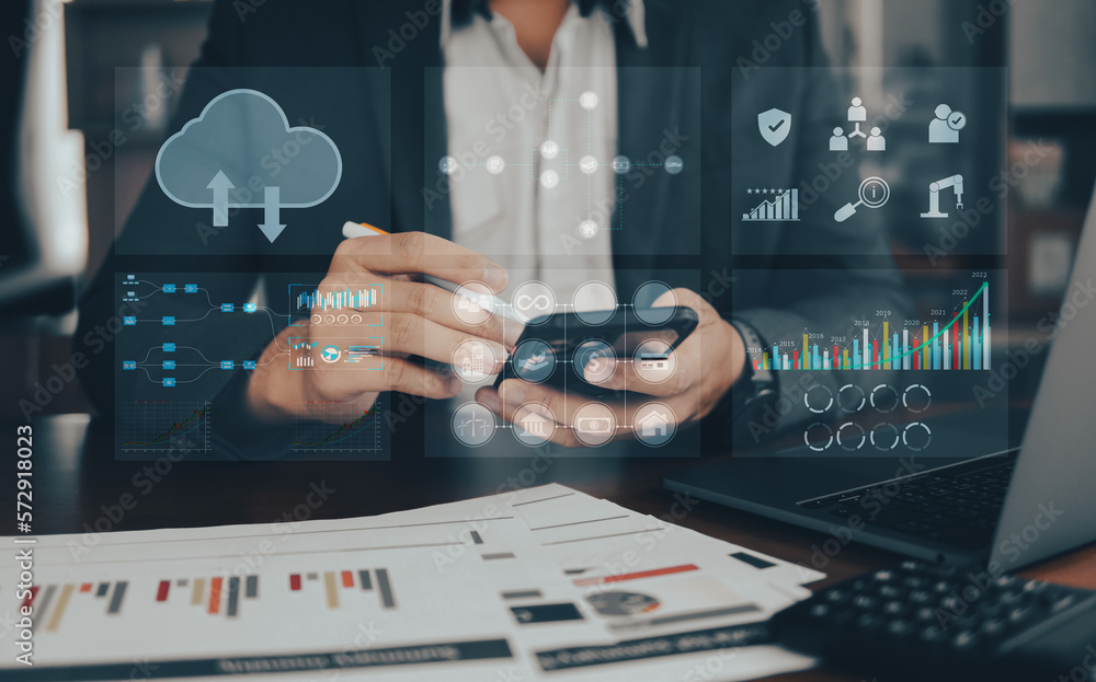 Business people using laptop with analytic graph and growing graph on virtual reality, graph investments for analysis market and demand. Business people using laptop with analytic graph and growing graph on virtual reality, graph investments for analysis market and demand.