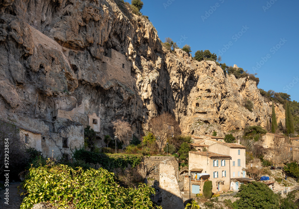 Cotignac is a French village in Provence. It is famous for its troglodyte dwellings that are carved into tufa cliffs covered with large stalactites, and its two feudal towers from 1033.