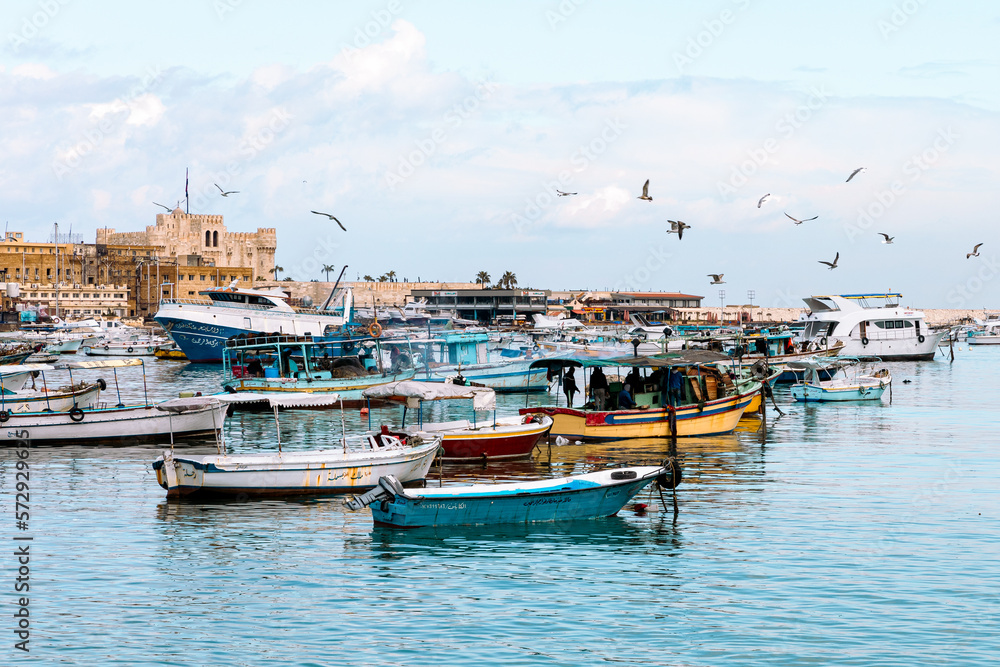 Fototapeta premium Harbor of Fishing Boats Floating on Blue Sea Water, Alexandria, Egypt. Africa.
