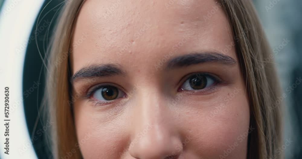 Close-up portrait of young, beautiful and natural woman opening her eyes. Girl opens her eye looking at camera. Vision. Beautiful eye. Natural Beauty Blonde. Close-up portrait of young, beautiful and natural woman opening her eyes. Girl opens her eye looking at camera. Vision. Beautiful eye. Natural Beauty Blonde.