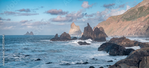 A Panoramic View of Tenerife's Rugged Coastline with a Photogenic Couple