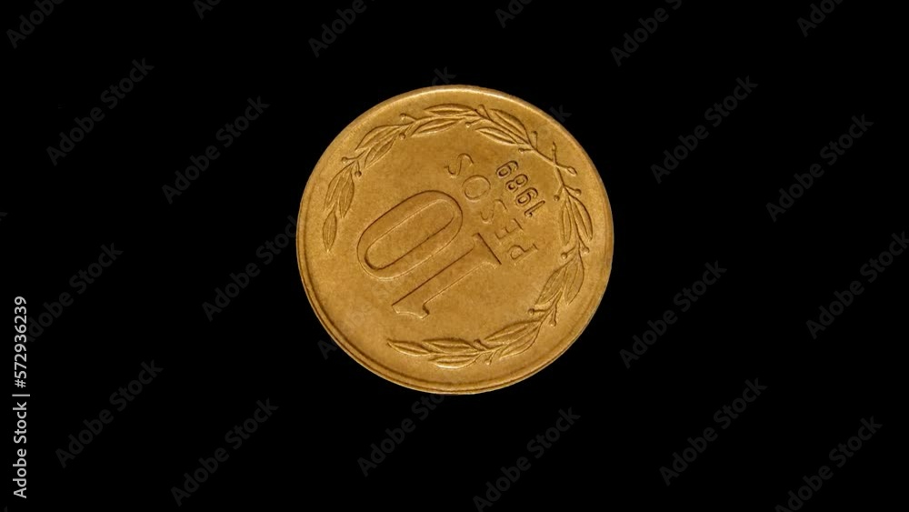 Reverse of Chile coin 10 pesos 1989, isolated in black background. 4k video Reverse of Chile coin 10 pesos 1989, isolated in black background. 4k video