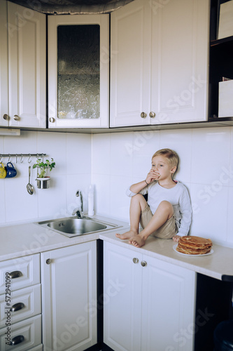  child in kitchen