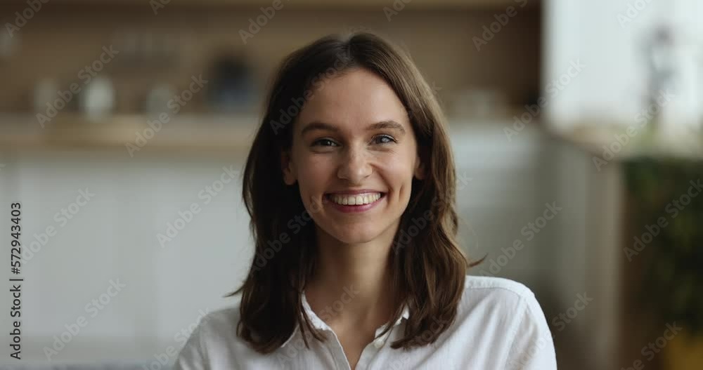 Face portrait of happy beautiful Latin s girl posing indoors, standing at home, looking at camera with toothy smile, laughing. Cheerful positive pretty young 20s woman head shot Face portrait of happy beautiful Latin s girl posing indoors, standing at home, looking at camera with toothy smile, laughing. Cheerful positive pretty young 20s woman head shot