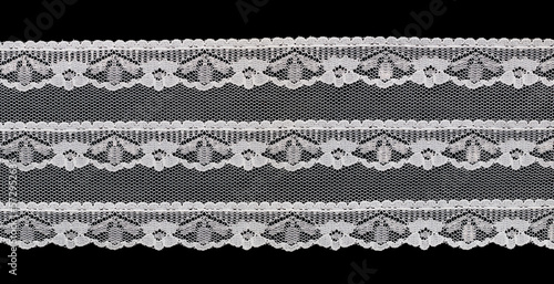 white floral lace isolated on black background