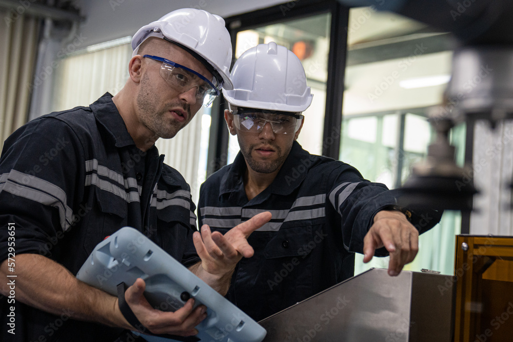 Two Diverse Professional Heavy Industry Engineers Wearing Safety Uniform and Hard Hats Working
Industry and engineering people technology concept . Two Diverse Professional Heavy Industry Engineers Wearing Safety Uniform and Hard Hats Working
Industry and engineering people technology concept .