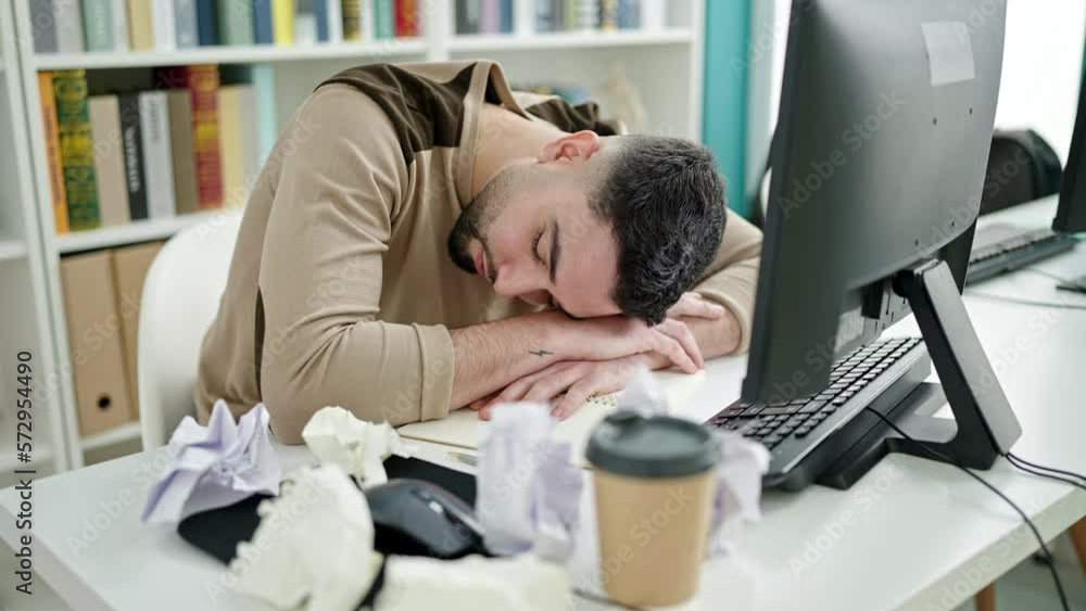 Young arab man student tired sleeping and wake up at university classroom Young arab man student tired sleeping and wake up at university classroom
