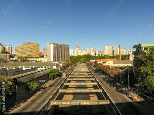 Belo Horizonte city center. Andradas Avenue. Arrudas River. Transit and commercial buildings. Cloudless blue sky. Horizontal.