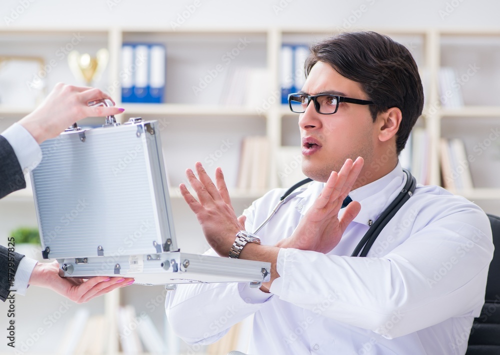 Young doctor in medical insurance fraud concept