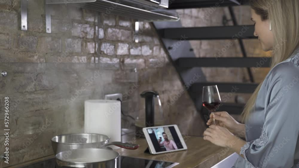 Woman having online date during cooking. Video call during social distancing Woman having online date during cooking. Video call during social distancing
