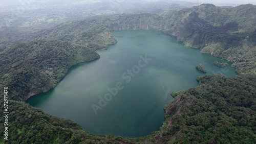 Ngozi lake in Mbeya, Tanzania. Drone view to second largest crater lake in Africa. Beautiful landscape surrounded by a bowl of high mountains. photo