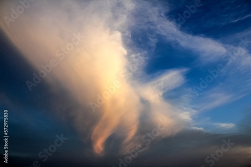 Unusual forms of clouds. Cloud in the shape of a man walking in the sky