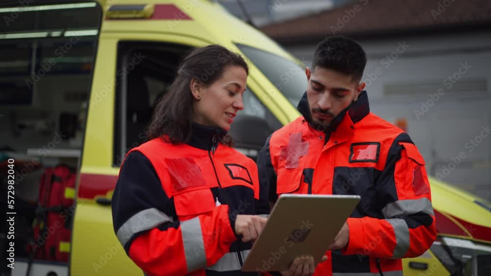 Team of rescuers preparing in ambulance car to outdoor operation. Team of rescuers preparing in ambulance car to outdoor operation.