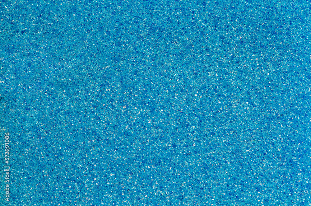 Foam rubber blue sponge, pores closeup background wallpaper, uniform