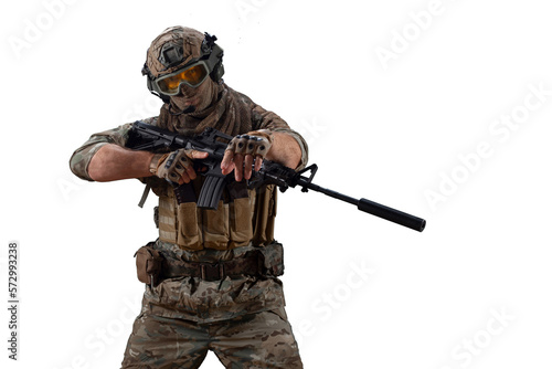 Special Mercenary soldie during a special operation walks with an automatic rifle and looking at camera. photo