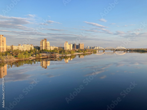 Kiev city bridge over the Dnieper river. Scenic view of the city landscape. The famous bridge. Residential buildings. view to the big river © Mister