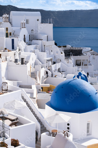 Traditional greek famous white architecture and blue domes on Oia, Santorini island, Greece. 