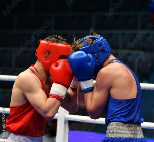 Two young men in the ring compete in boxing 