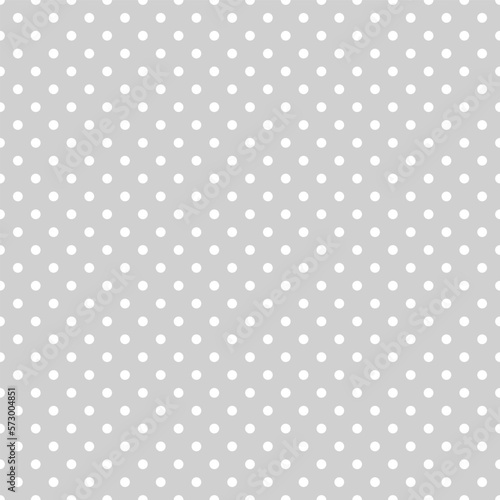 White small polka dots on a light gray background. Abstract vintage pattern. Seamless nordic pattern. Vector illustration of a colorful background.