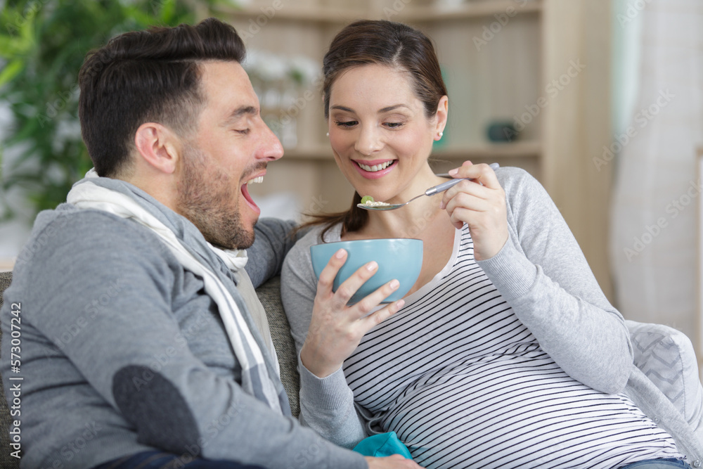 young happy couple enjoys having breakfast together young happy couple enjoys having breakfast together