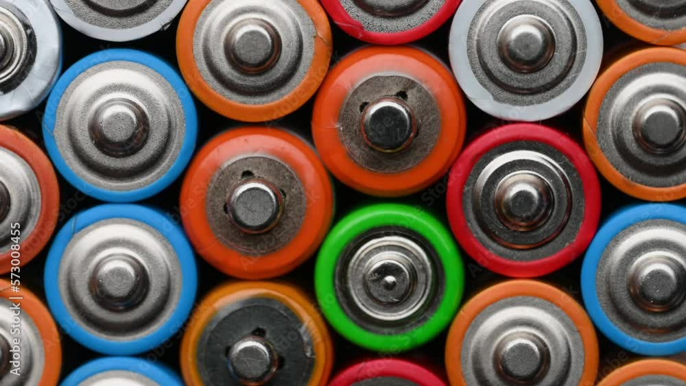 Close-up batteries rotating on a turntable, top view. Hazardous waste concept Close-up batteries rotating on a turntable, top view. Hazardous waste concept
