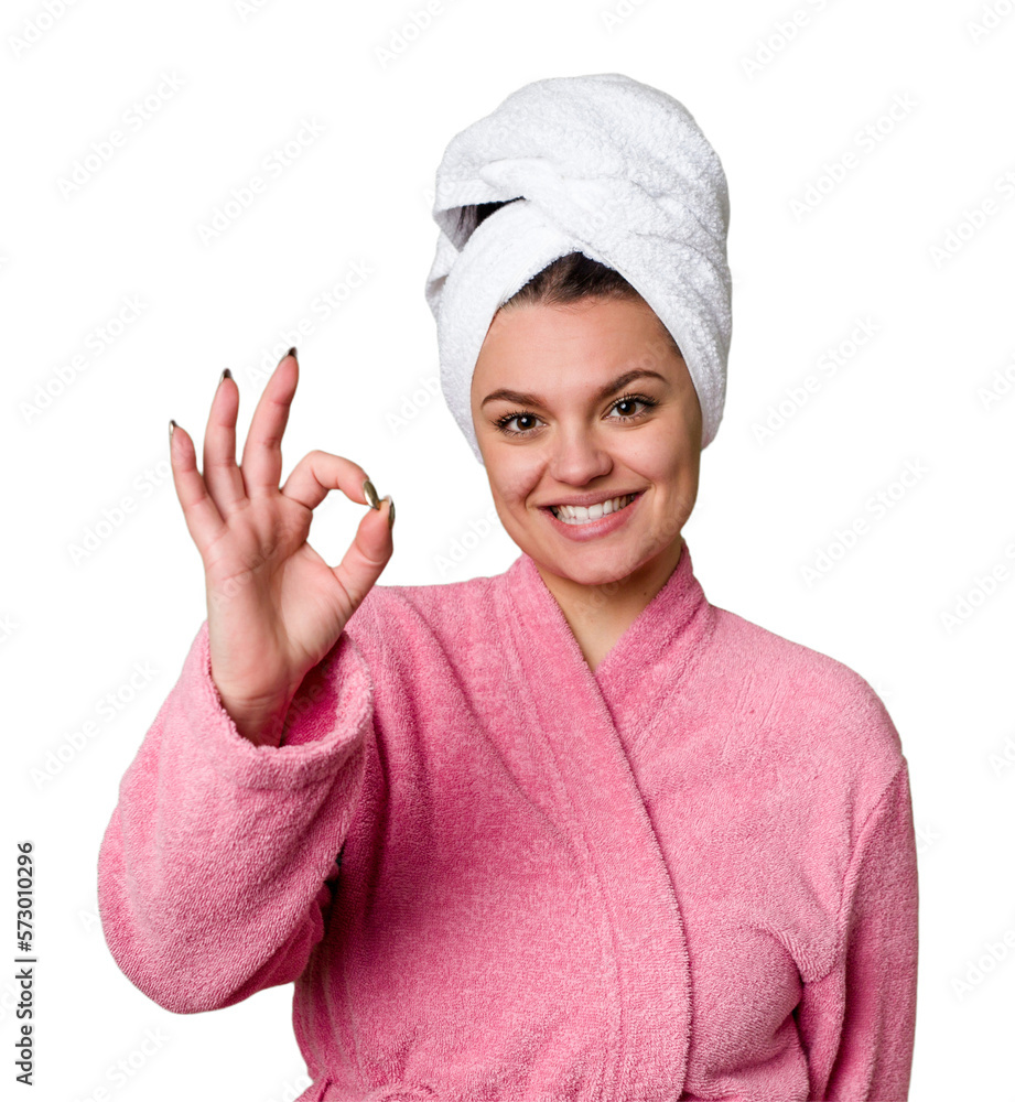 Young caucasian woman in bathrobe isolated cheerful and confident showing ok gesture. Young caucasian woman in bathrobe isolated cheerful and confident showing ok gesture.