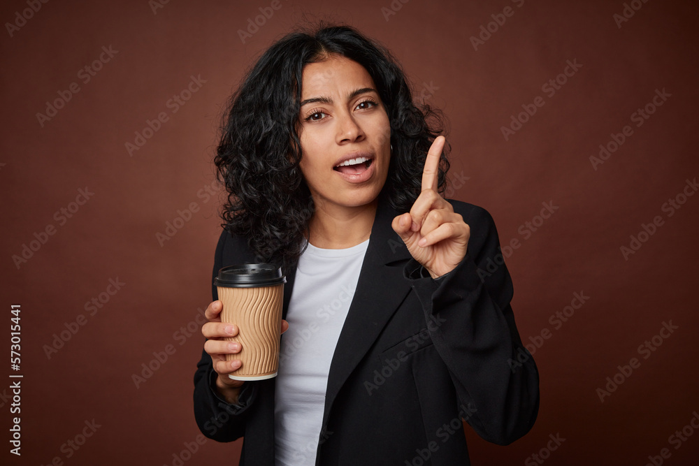 Young business woman drinking a take-away coffee having an idea, inspiration concept. Young business woman drinking a take-away coffee having an idea, inspiration concept.