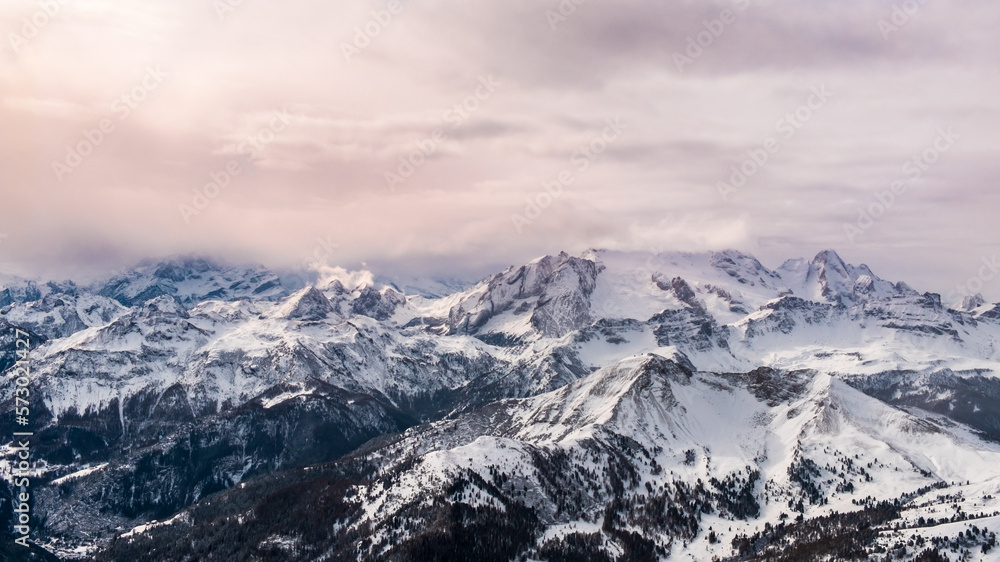 Stormy clouds in italian dolomites in a snowy winter