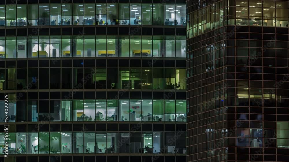 Close up view to panoramic office windows in Skyscrapers International Business Center of City at night timelapse from top Close up view to panoramic office windows in Skyscrapers International Business Center of City at night timelapse from top